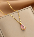 Elegant 18k Gold-Plated Necklace with Pink Teardrop Crystal Pendant and Delicate Floral Setting