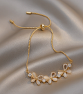 Elegant 18K Gold-Plated Titanium Slider Bracelet with Floral Design and Zirconia Details