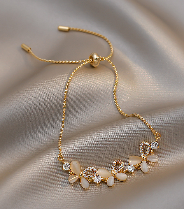Elegant 18K Gold-Plated Titanium Slider Bracelet with Floral Design and Zirconia Details